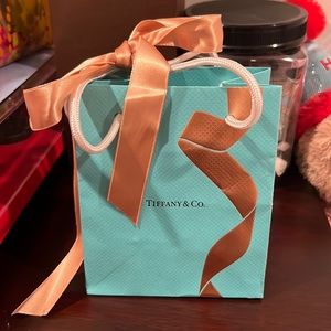 Tiffany & Co. Gold Detailed Gift Bag with accompanying golden ribbon